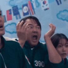 a man wearing a green jersey with the number 390 on it is making a funny face