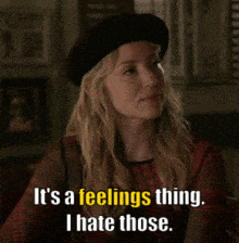 a woman wearing a black beret says " it 's a feelings thing i hate those "