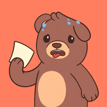 a brown teddy bear is holding a piece of paper in his hand