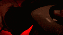 a person is holding a lighter in front of a fire