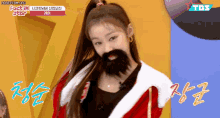 a girl wearing a santa claus costume with a fake beard
