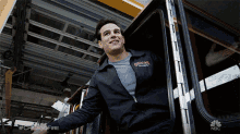 a man wearing a jacket that says chicago fire is smiling