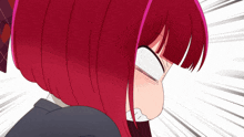 a girl with red hair is making a face