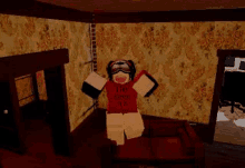 a sock monkey is sitting on a couch in a living room .