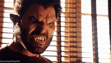 a close up of a man 's face with a beard and fangs