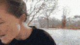 a close up of a young boy 's face with a blurry background .
