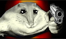 a hand holding a gun in front of a drawing of a cat