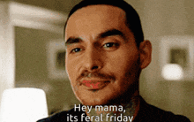a close up of a man 's face with the caption hey mama its feral friday