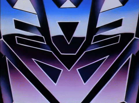 A screen transition where the Decepticon insignia flips to become the Autobot insignia