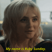 a woman says her name is ruby sunday in yellow letters
