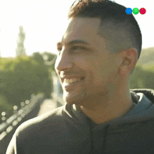 a close up of a man 's face with a few balls on his head