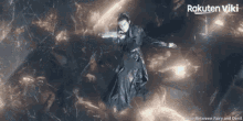 a woman in a black dress is flying through the air with rakuten viki written on the bottom
