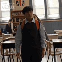 a boy with a backpack walks through a classroom with son of a catch written on the bottom