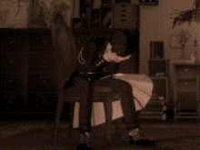 a person is sitting in a chair in a room