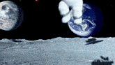 a shadow of an astronaut is cast on the moon in front of earth