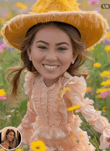 a woman wearing a cowboy hat and ruffled dress is smiling in a field of flowers