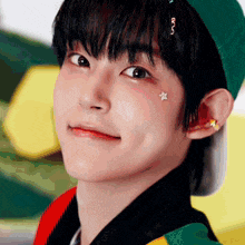a close up of a person with a star on their face