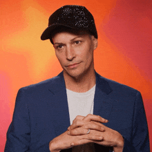 a man wearing a hat and a blue jacket