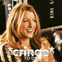 a woman is sitting on a couch and smiling with the words `` i dont know what to do '' .