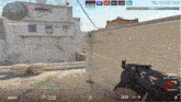 a person is holding a gun in front of a building with the number 30 on the screen