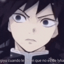 a close up of a person 's face with the words giyu cuando le dicen que no es de lylia on the bottom