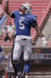 a football player wearing a blue jersey with the number 5 on it