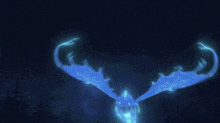 a glowing blue object in the dark with a dark background