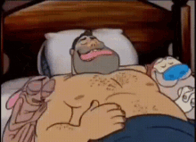 a man with a beard is giving a thumbs up in bed
