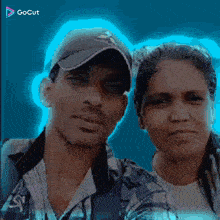 a man and a woman are posing for a picture in front of a blue background with gocut written on the bottom