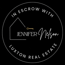 a logo for a real estate agent called jennifer nelson with a house and a key .