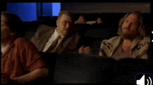 three men are watching a movie and one of them says " our fucking troubles are over "