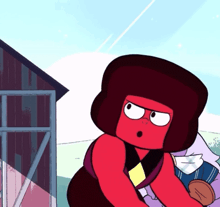 a red cartoon character is standing in front of a barn