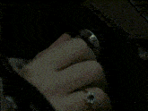 a woman is sleeping in a car with her head on the steering wheel