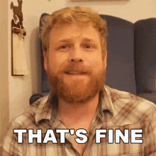a man with a beard says that 's fine in a plaid shirt