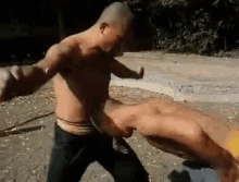 Head Stomach GIF - Shaolin Warrior Training Skull Skills GIFs