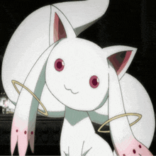 a close up of a white cat with pink ears and red eyes