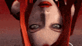 a close up of a person 's face with red hair and green eyes .