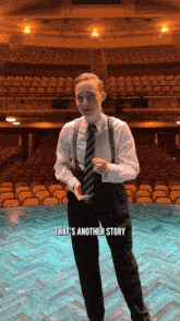 a man in a suit and tie stands on a stage with the words that 's another story written below him
