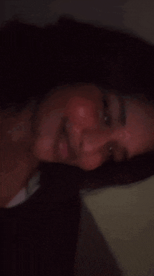 a close up of a woman 's face with a smile on her face