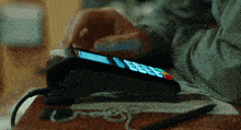 a close up of a person using a credit card reader with the number 9999 on the screen