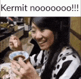 a woman is sitting at a table with a bowl of food and a caption that says kermit nooooo