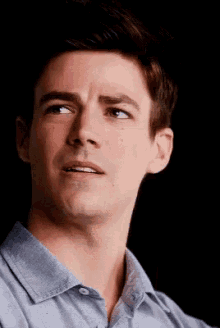 a close up of a man 's face with his eyes closed