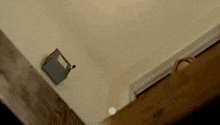 a woman with a surprised look on her face is looking down