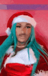 a woman with blue hair is dressed as santa