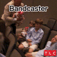 a man is holding a baby and the word bandcaster is on the image