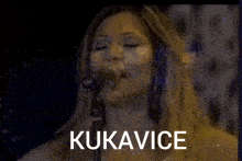 a woman singing into a microphone with raspisi izbore written on the bottom