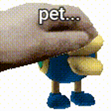 a hand is petting a stuffed animal that says pet