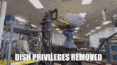 a man in a yale forklift is moving a dish satellite