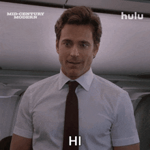 a man in a white shirt and tie says hi on hulu
