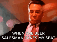 a man in a suit and tie is talking about when the beer salesman takes my seat